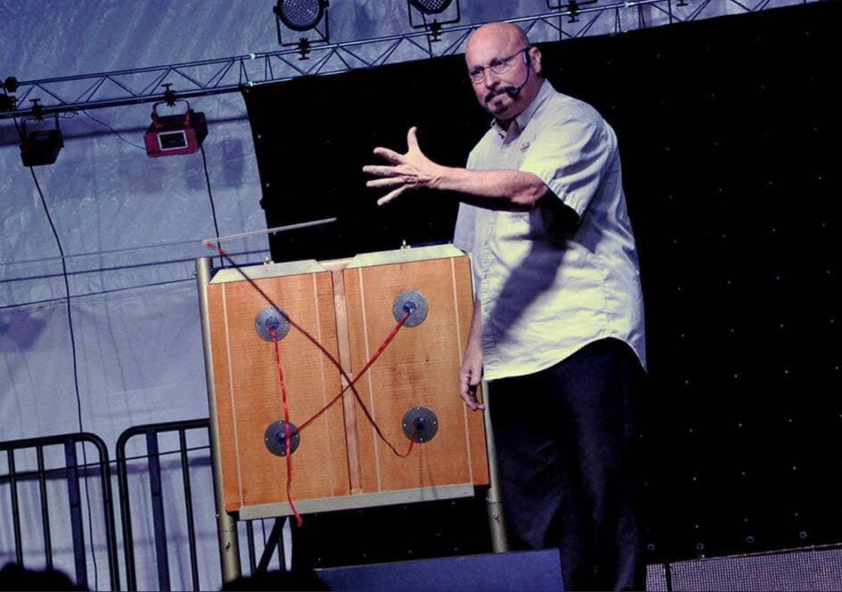 Ron Diamond performing magic and illusion on stage